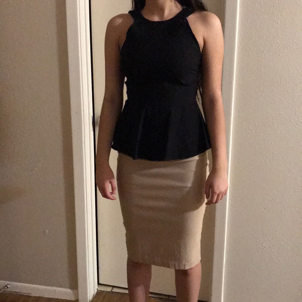 Black blouse with beige skirt